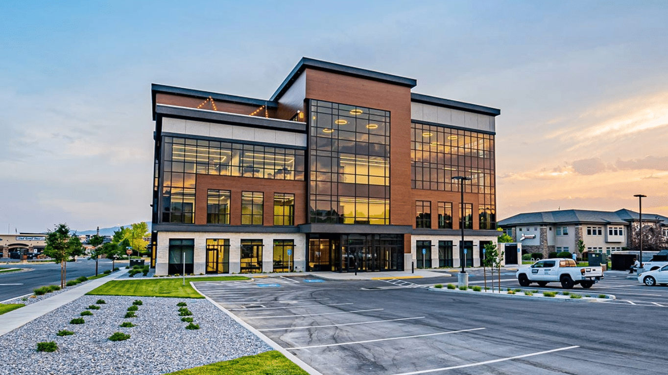 Facade and parking lot of Hunter's Grove building.