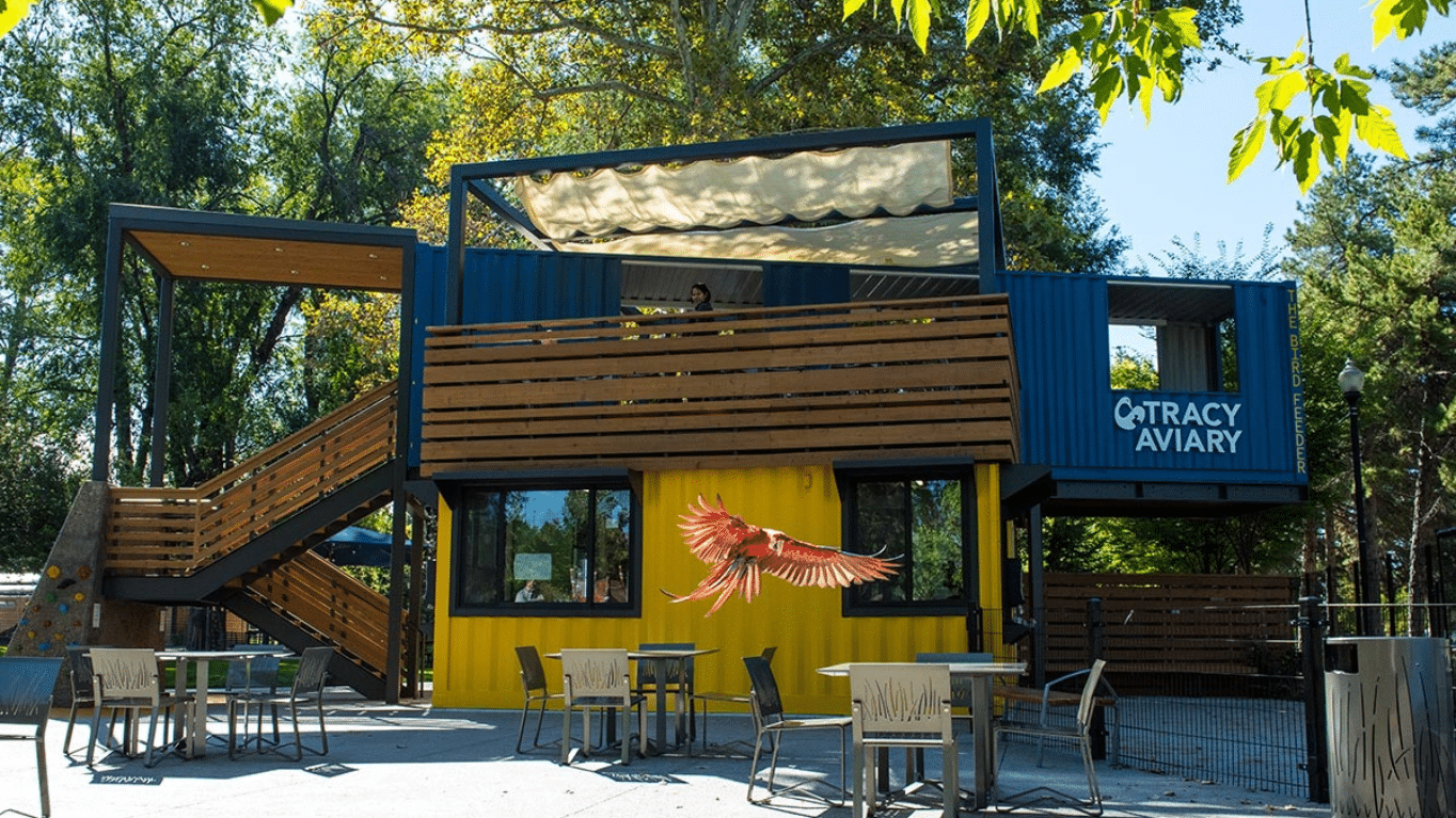 a bird flying over the cafe inside Tracy Aviary.